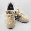 Baskets basses New Balance WL574 pour femme, taille 36,5, couleur beige, vue de face, en excellent état